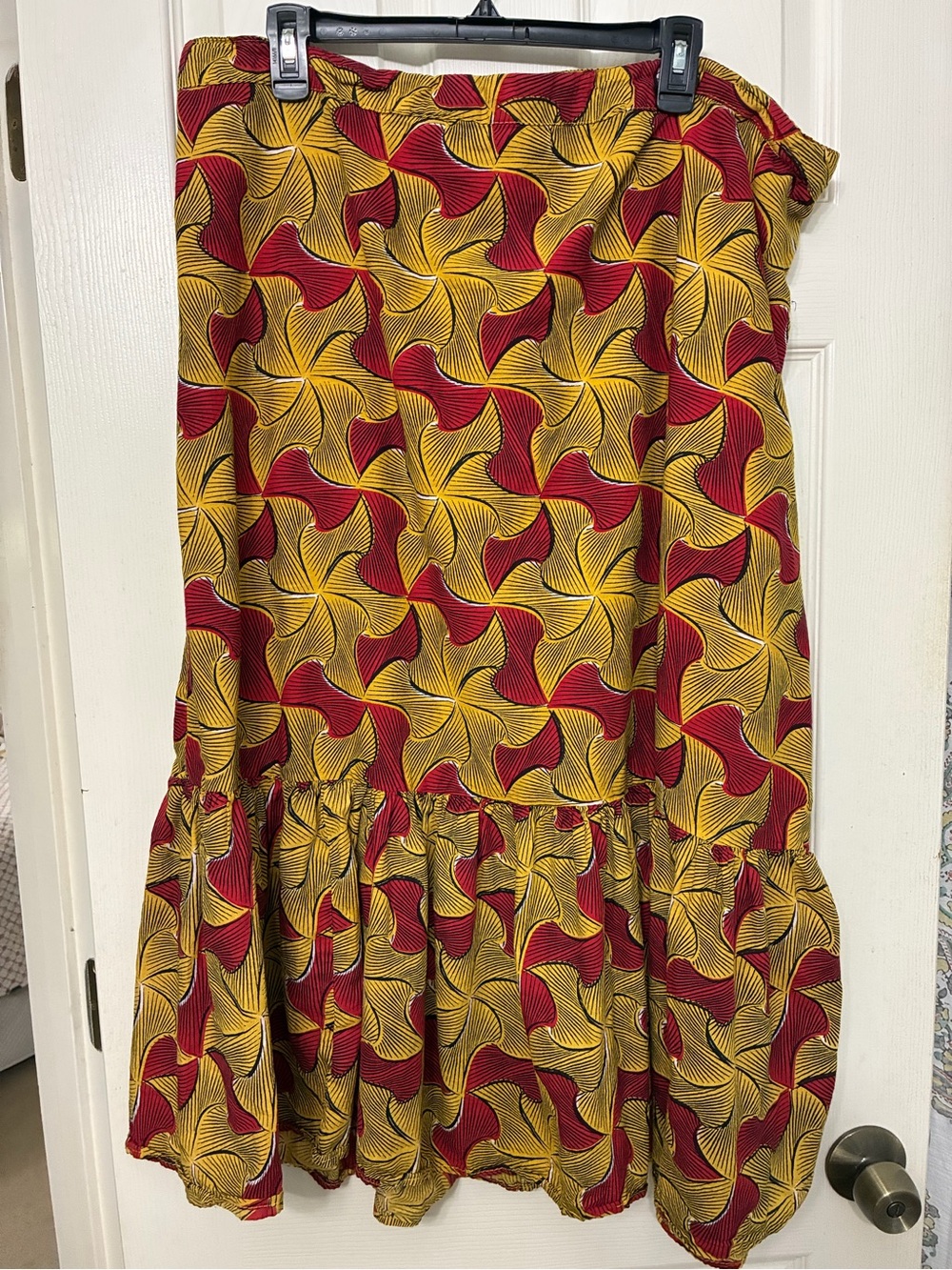 Unique spectrum, abstract pattern, maxi skirt, in yellow and red.